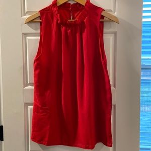 Red top with ruffle neck line
